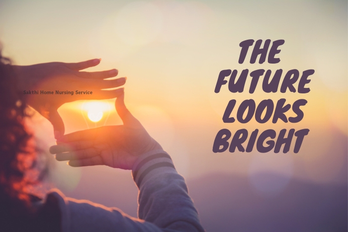 Hands framing the sunrise, symbolizing optimism and forward-thinking care provided by Sakthi Home Nursing Service in Coimbatore, with the promise of a bright future