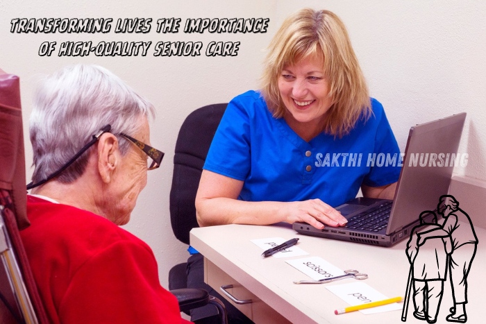 Transforming lives with high-quality senior care in Coimbatore by Sakthi Home Nursing. Smiling caregiver in blue uniform engaging with an elderly woman at a desk, highlighting compassionate and professional senior care services