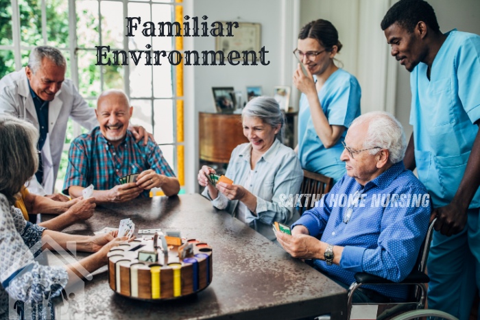 Providing care in a familiar environment in Coimbatore with Sakthi Home Nursing. Elderly individuals and caregivers enjoying a card game together, highlighting the comfort and joy of receiving personalized home care