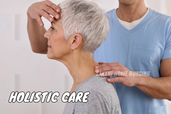 Holistic elder care services by Sakthi Home Nursing Service in Coimbatore, focusing on physical therapy and well-being. Caregiver providing gentle neck and shoulder support for a senior woman, emphasizing a holistic approach to home nursing care